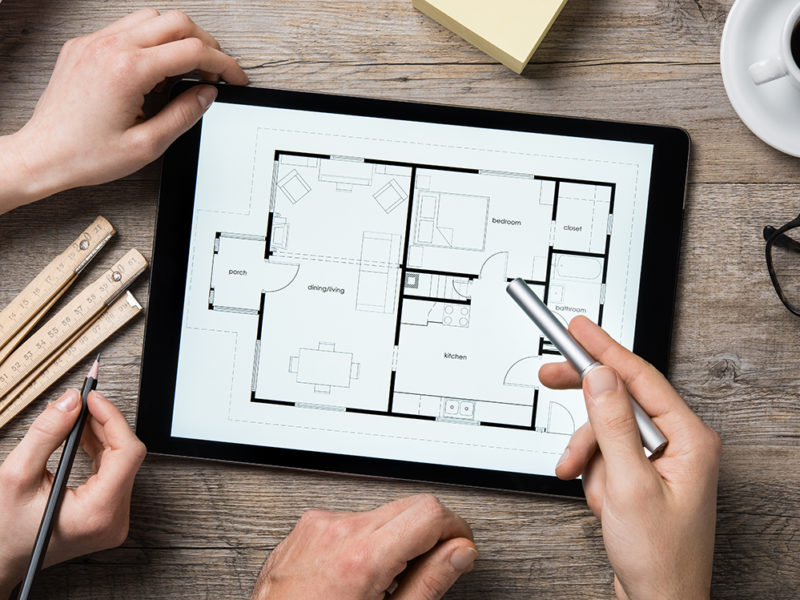 Architect working on digital tablet