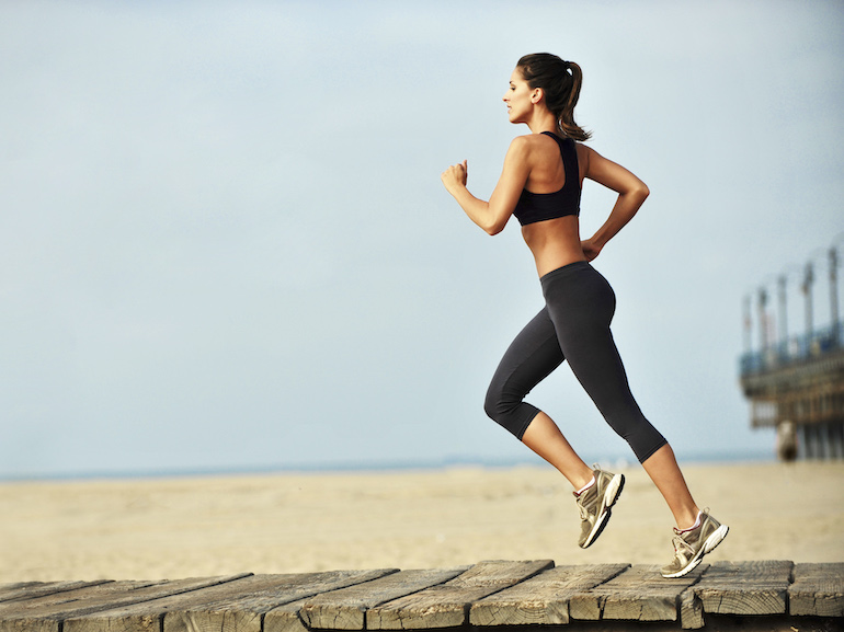 Young Woman Jogging on Boardwalk Santa Monica Beach