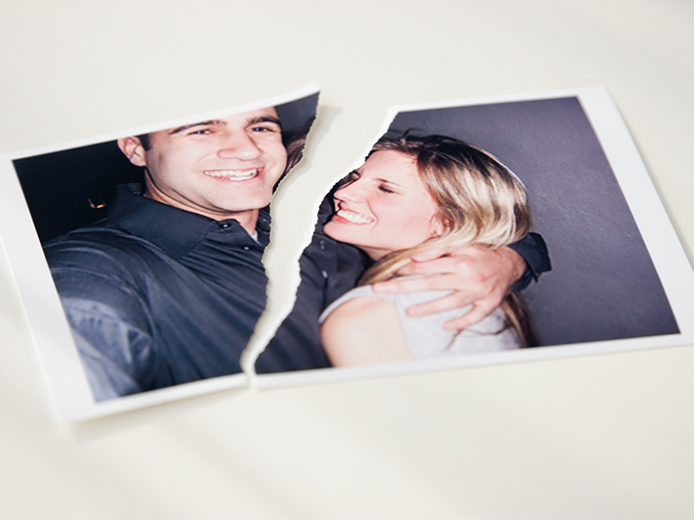 Photograph of couple ripped in half