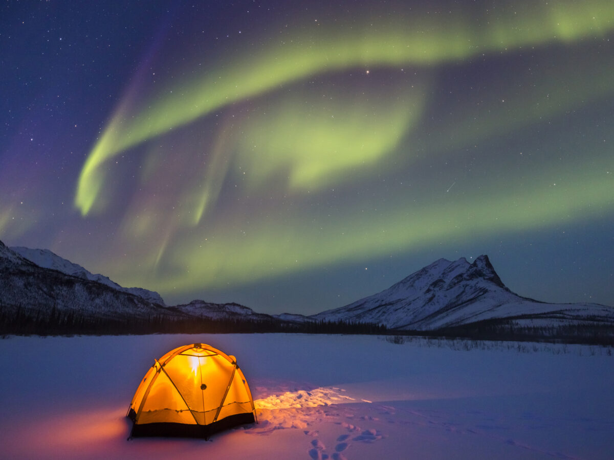 Northern lights over Alaska winter camp