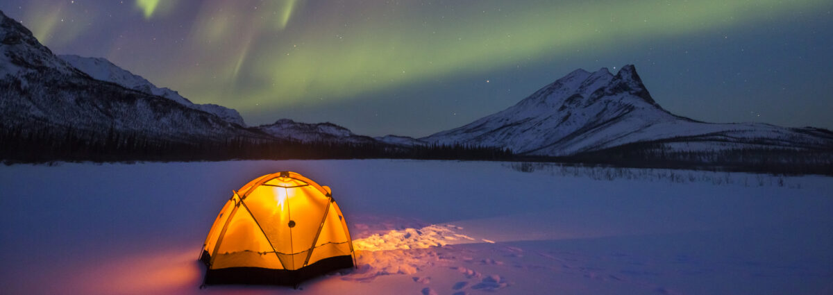 Northern lights over Alaska winter camp