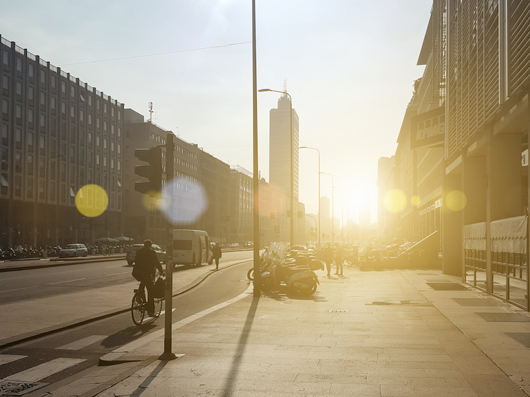 Sunset light on Via Vittor Pisani near Milan Central Station. Milan, Italy