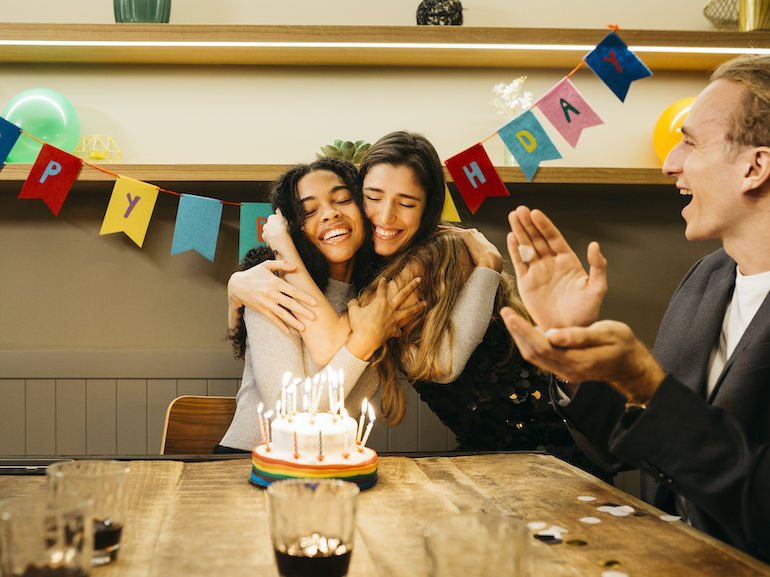 Group of multiracial young people in a birthday party