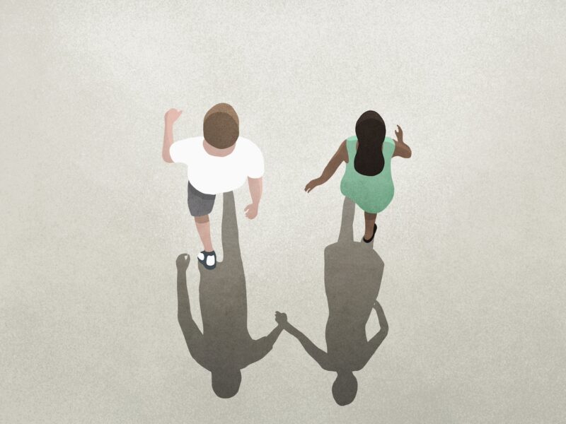 View from above shadow of couple holding hands