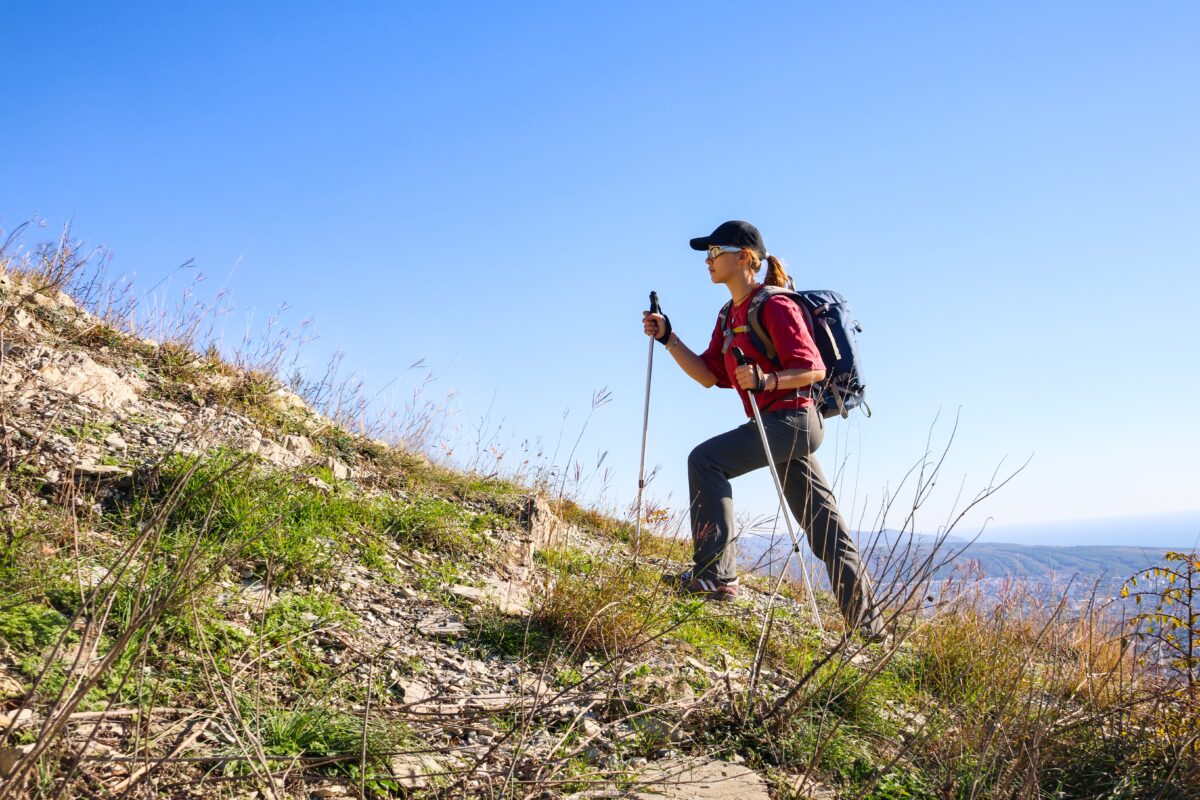 Young,Girl,With,A,Backpack,Is,Hiking,Alone,In,Nature